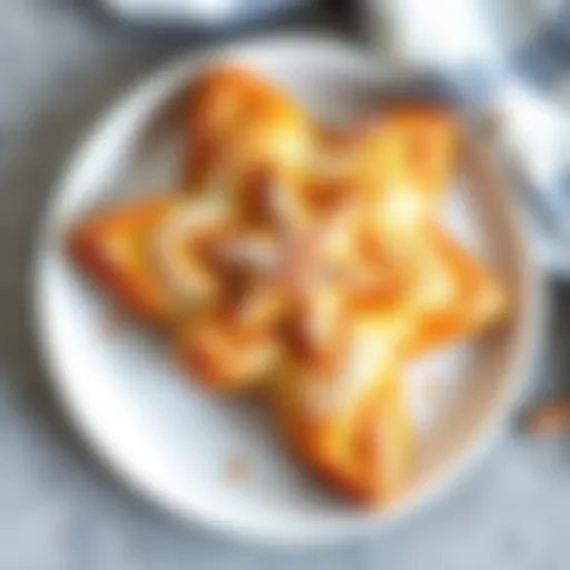 Freshly baked Cinnamon Star Bread on a white plate with a golden-brown crust, dusted with powdered sugar.