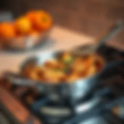 A stainless steel Demeyere 7 pan on a stove with a delicious dish inside after 20 minutes of cooking at 74F.