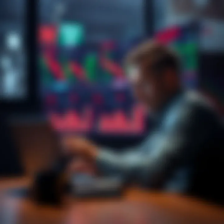 A man sitting at a desk, focused on a laptop screen displaying stock market charts with a concerned expression