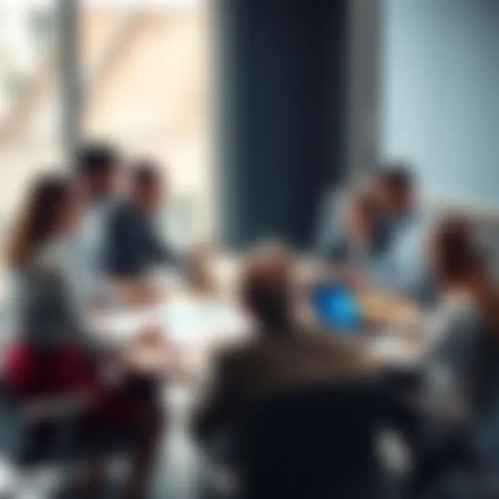 A group of sales professionals discussing effective selling techniques around a table with charts and laptops