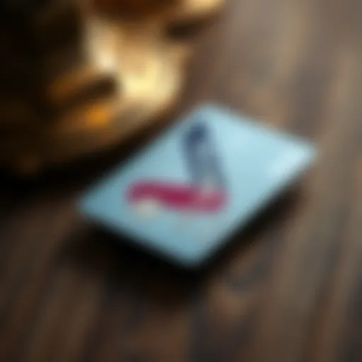 A close-up of a scratched Revolut card resting on a wooden table, showing visible wear compared to a pristine traditional bank card nearby