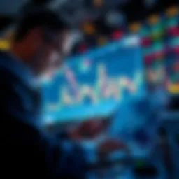 A trader looking at stock charts with a laptop and phone, symbolizing insider trading.