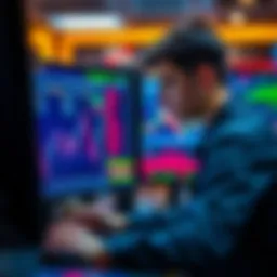 A young trader studies stock charts on a computer screen, focusing on technical analysis and market data.
